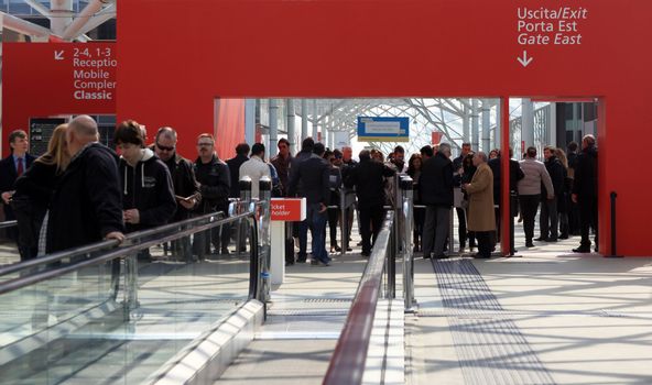 People enter Salone Internazionale del Mobile - International home furnishing and accessories exhibition