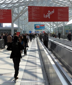 People enter Salone Internazionale del Mobile - International home furnishing and accessories exhibition