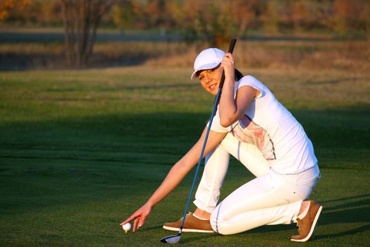 girl golf player preparing for shot