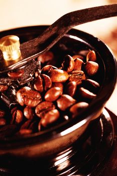 closeup of coffee beans in a vintage coffee mill