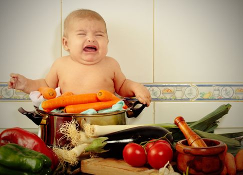 a baby crying in a pot becouse is going to be cookerd