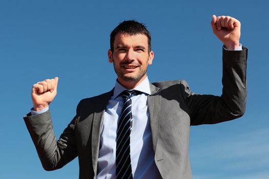 handsome businessman and blue sky in summer