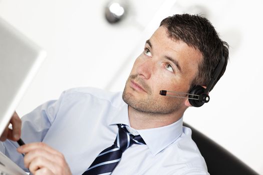 young man working with headset in office