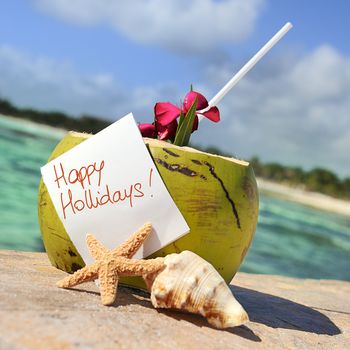 Coconut cocktail starfish tropical Caribbean beach refreshment and towel