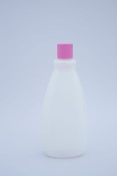 Liquid cosmetic bottle with pink lid