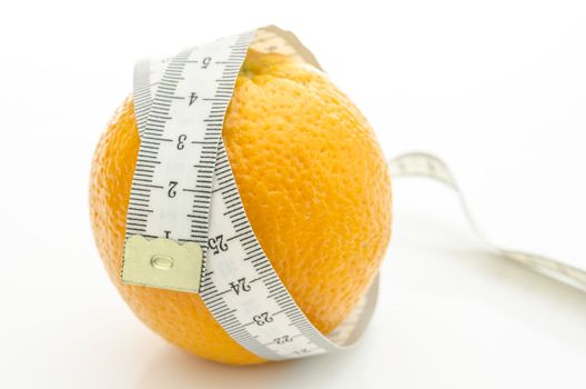 Orange with white measuring tape wrapped around it. On a white background.