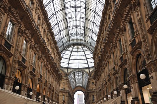 The Galleria Vittorio Emanuele II is a covered double arcade formed of two glass-vaulted arcades at right angles intersecting in an octagon; it is prominently sited on the northern side of the Piazza del Duomo  in Milan, and connects to the Piazza della Scala.