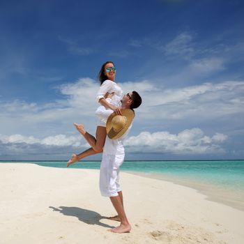 Couple on a tropical beach at Maldives