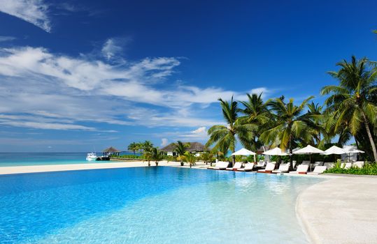 Luxury swimming pool in the tropical hotel