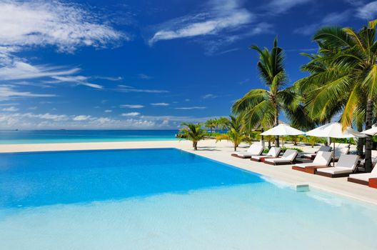 Luxury swimming pool in the tropical hotel