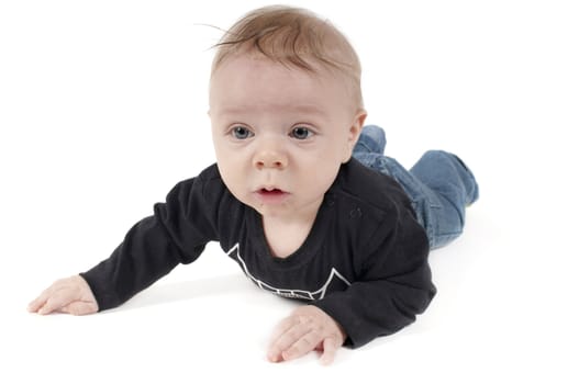 Shot of little baby lying on white background