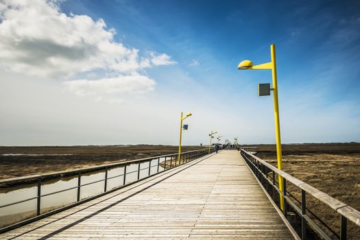 Bridge on the beach of St. Peter-Ording at the North Sea on a sunny day