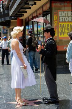 LOS ANGELES - MAY 27: Charlie Chaplin and Marilyn Monroe Impersonators on Hollywood Blvd., May 27, 2009 in Hollywood, CA