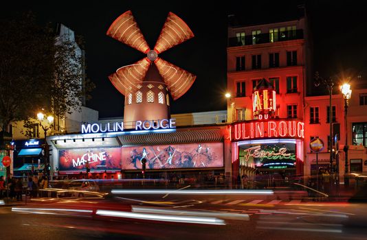 PARIS - NOV 12: The Moulin Rouge by night, on November 12, 2012 in Paris, France. Moulin Rouge is a famous cabaret built in 1889, locating in the Paris red-light district of Pigalle