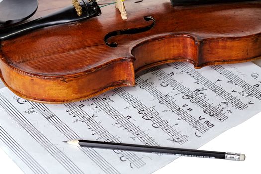 Old violin with notes