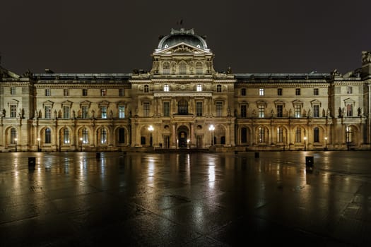 PARIS - NOV 09 : View of the Pavillon Richelieu in the evening, Nov 09, 2012, Paris, France. The pyramid serves as the main entrance to the Louvre Museum
