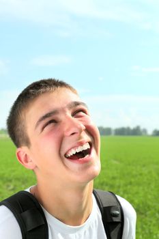 happy teenager portrait in the summer field