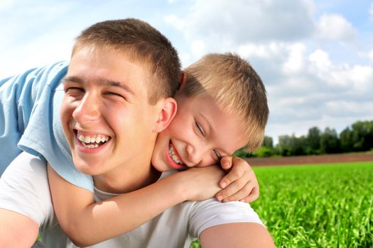 happy brothers in the summer field