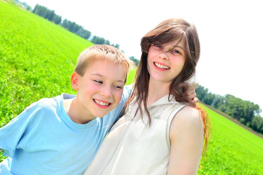 brother and sister in the summer field