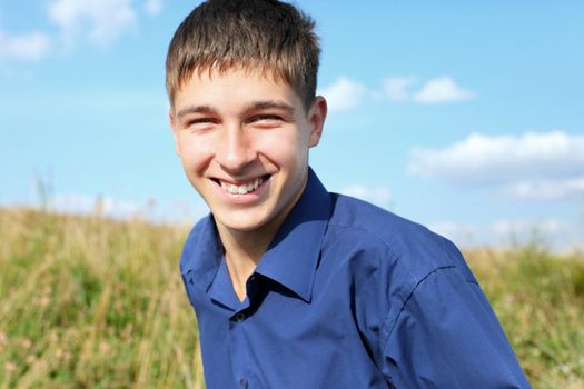 happy and smiling teenager portrait in the field