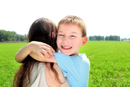 brother and sister in the summer field