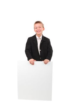cheerful schoolboy hold blank cardboard isolated on the white