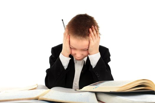 dissatisfied schoolboy on the table