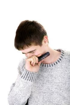 sorrowful young man with mobile phone on the white background