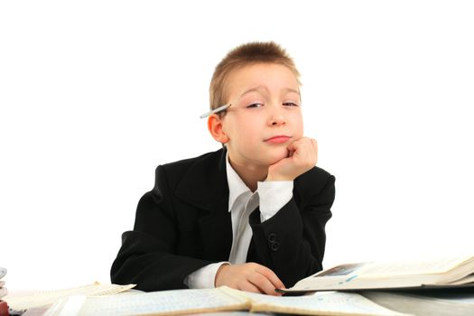 bored and tired schoolboy on the table