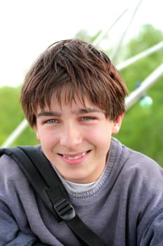 smiling teenager portrait on the nature background