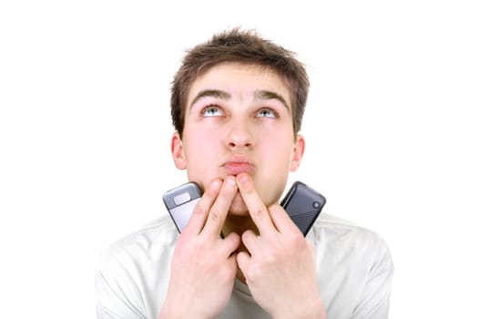 young man is thinking with two mobile phones on the white background