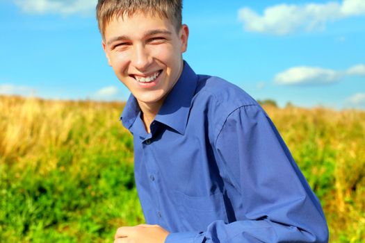 happy and smiling teenager running in the field