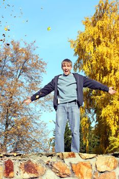 happy teenager in the autumn park