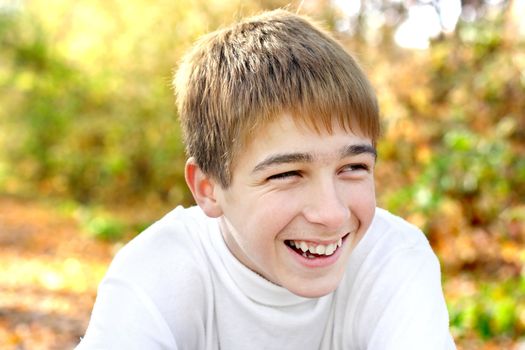 happy teenager portrait in the autumn park