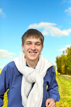 happy teenager running on the autumn field