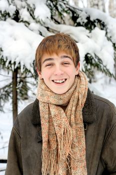 happy smiling teenager in winter forest