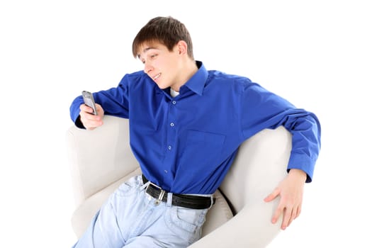 happy teenager with mobile phone in a chair on the white background