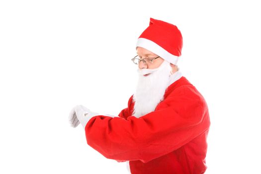 santa claus looking on the watch. isolated on the white background