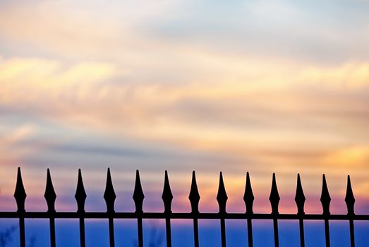 A fence against a golden sunset