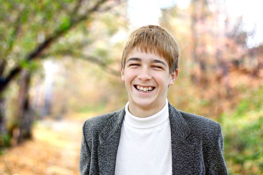 happy teenager portrait in the autumn park