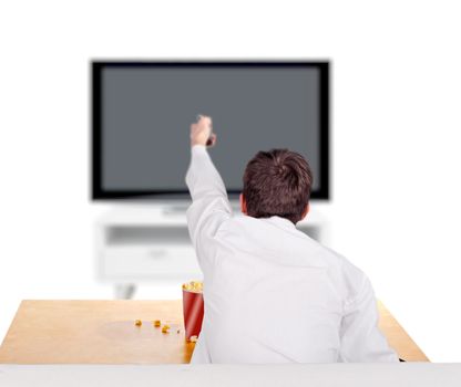 Teenager with Remote control sitting on the Sofa and Watching Tv-set