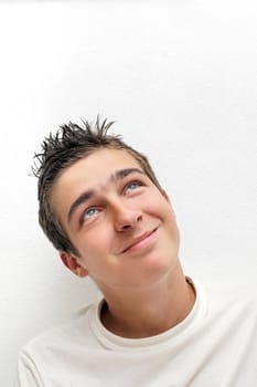 Happy Young Man on the White Wall background