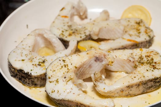 The fried fish on the frying pan
