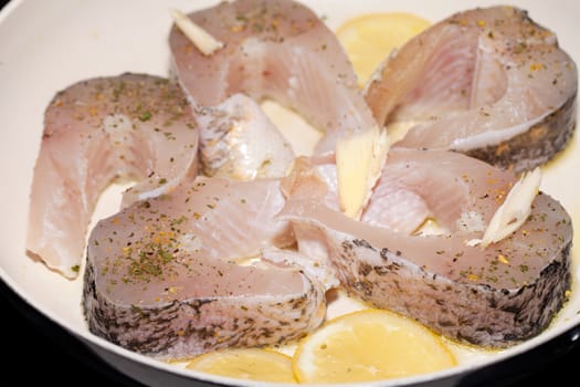 The fried fish on the frying pan