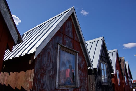 Beautiful red fishing huts on the coast Faaborg Denmark