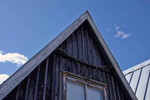 Beautiful black fishing huts on the coast Faaborg Denmark