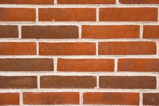Background of new red brown brick wall texture in close view