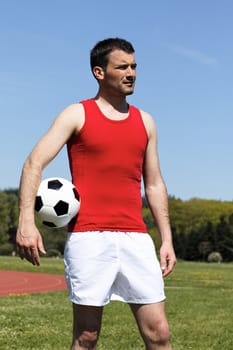 man with ball and blue sky in summer
