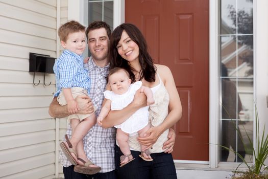 Portrait of a young family with mother, father, son and daugther