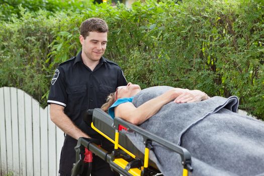 Male emergency worker pushing a stretcher